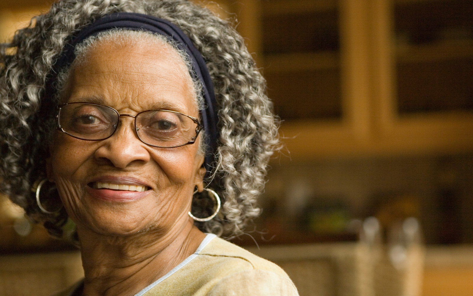 An elderly woman smiles