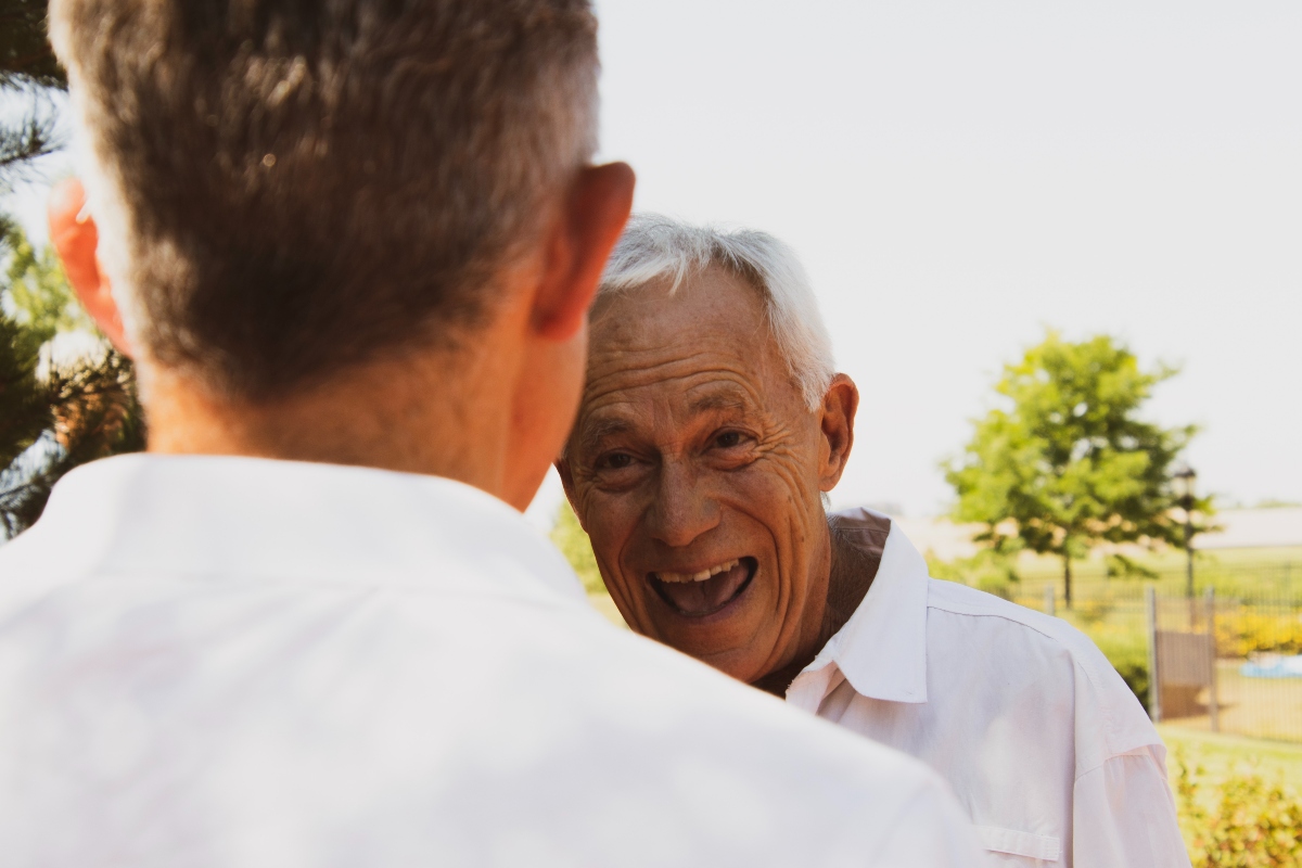 A man smiles at his son