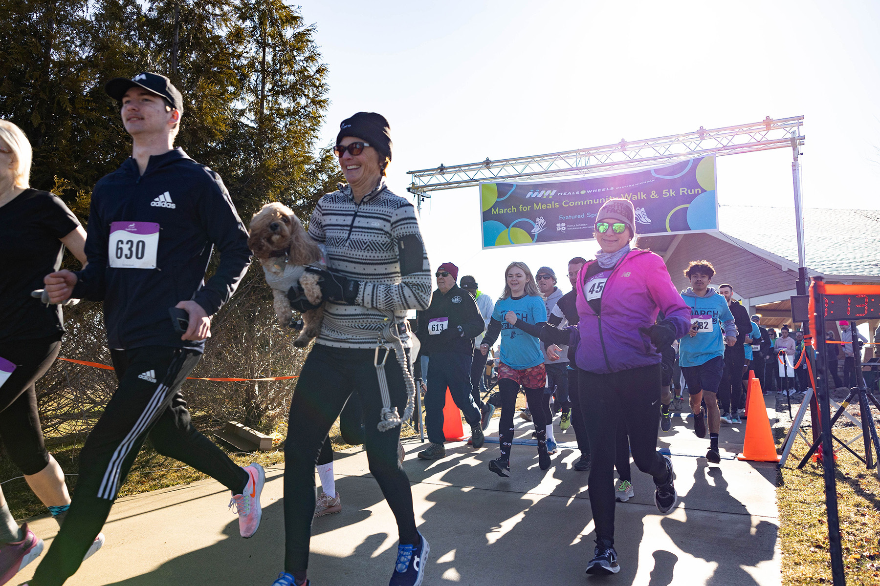 A group of participants bust out of the starting line for the March for Meals Community Walk & 5k