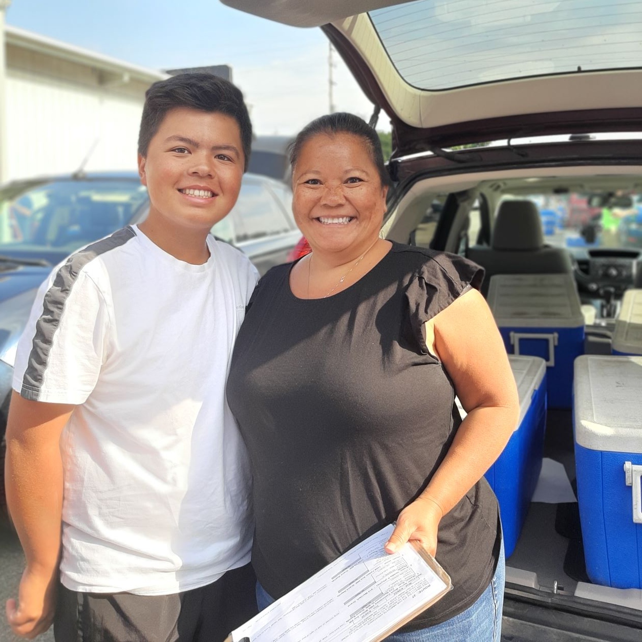 A mother and child volunteer together as drivers for Meals on Wheels Western Michigan.