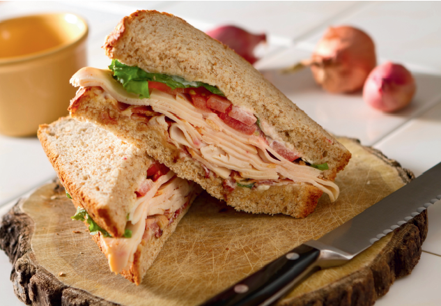 A picture of a turkey sandwich with provolone cheese for the story about how Meals on Wheels gives you options